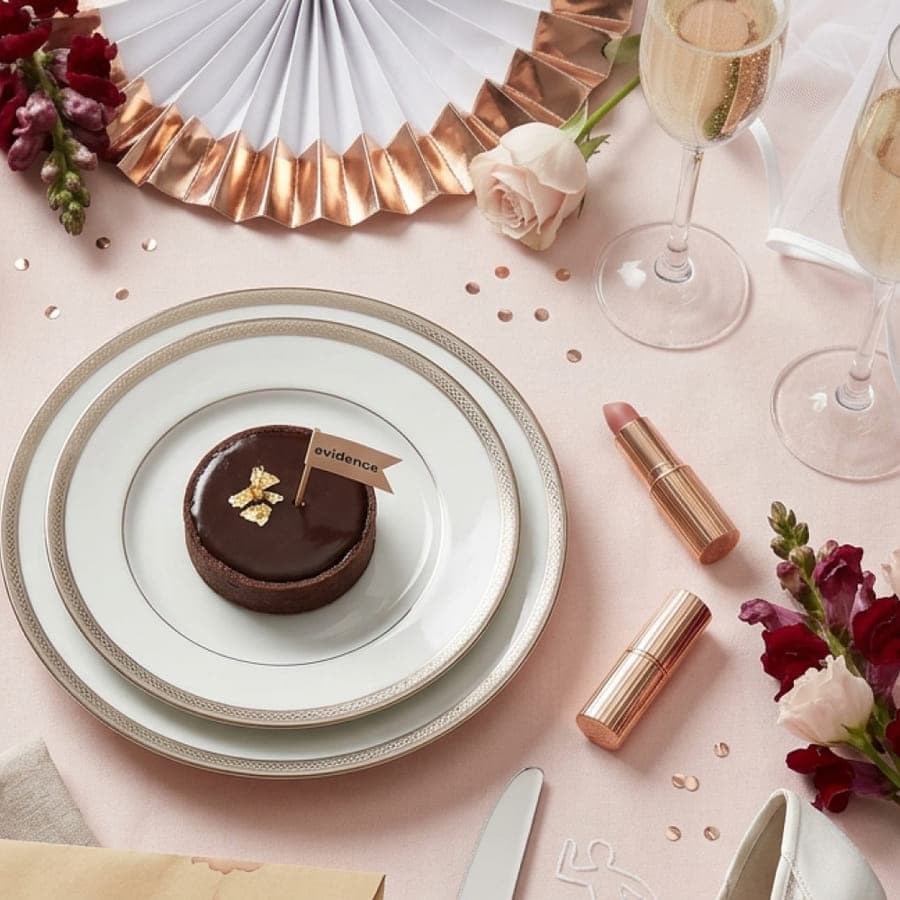 Dessert with an “evidence” flag on a pink table setting